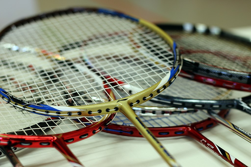 Several badminton rackets