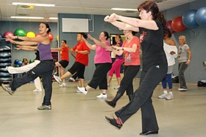 People doing a Latin dance based exercise routine.
